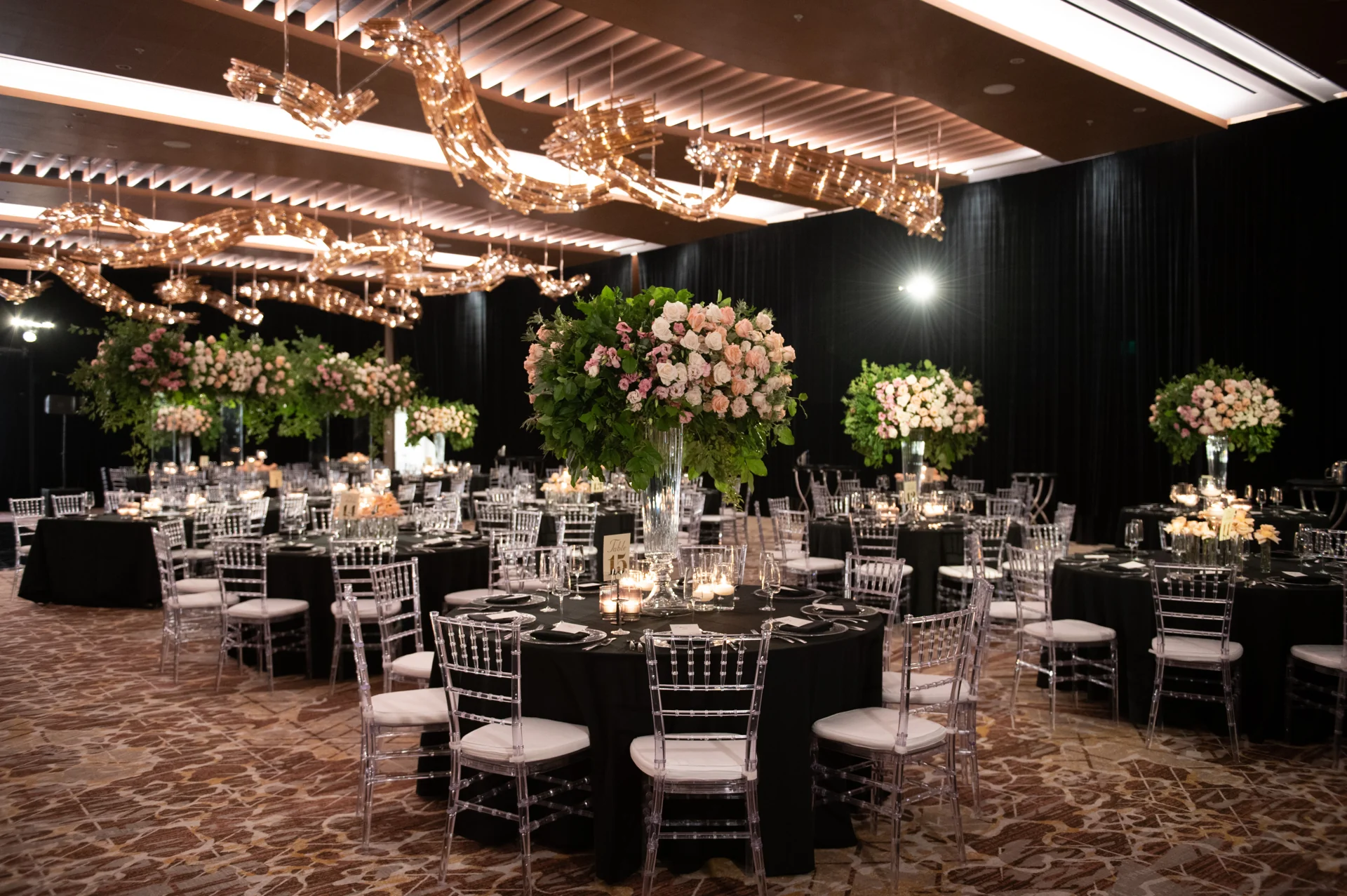 Floral centerpieces, chandeliers and candlelit reception tables for Natasha and Anish.