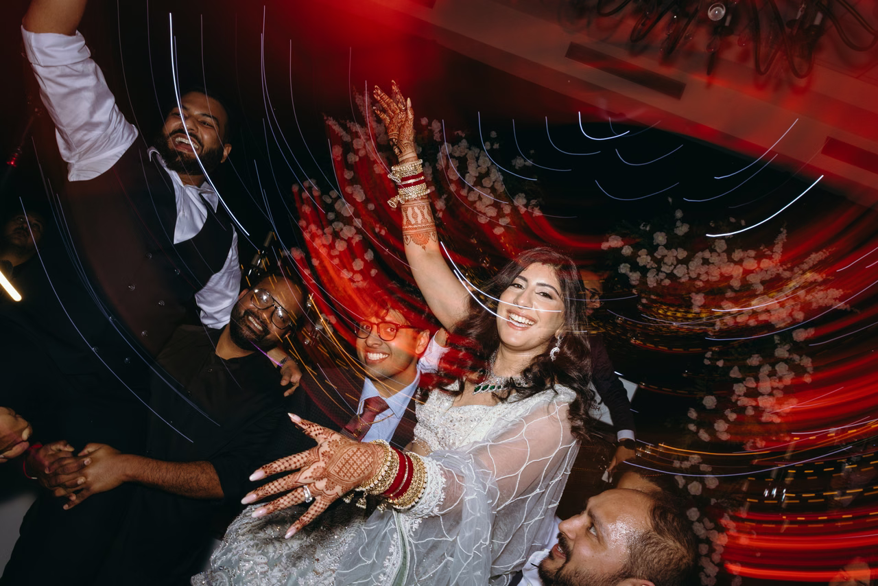 Priyanka celebrating with friends amid glowing lights on the dance floor