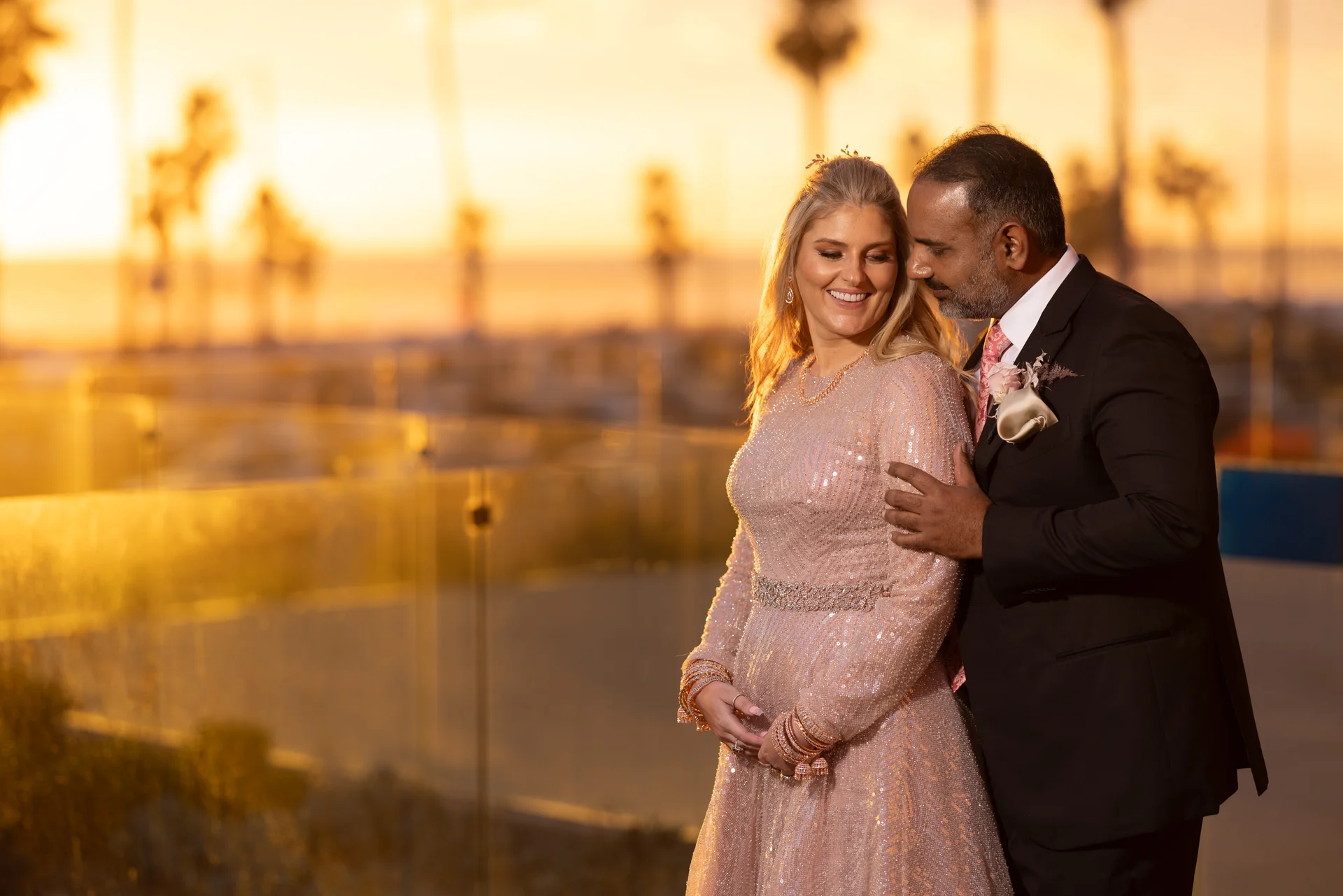 Tara and Usman sharing a sunset embrace at Paséa Hotel & Spa.