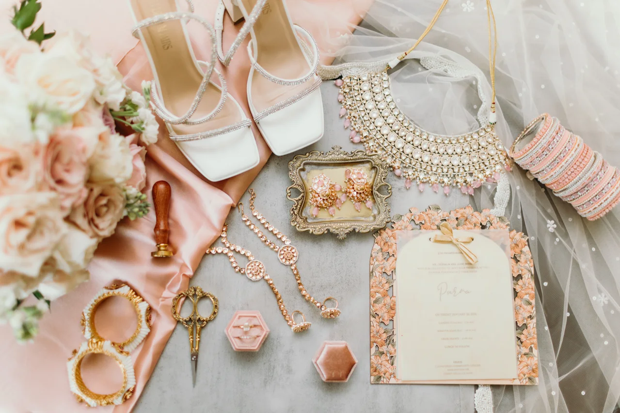 Purna’s bridal jewelry, shoes and invitation arranged before the ceremony